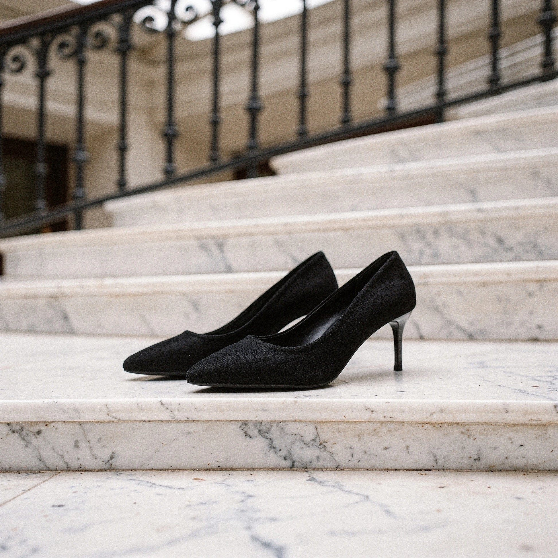 Elegant pointed mid heel sandals in soft beige leather, featuring a sleek design and ankle strap, detailed view