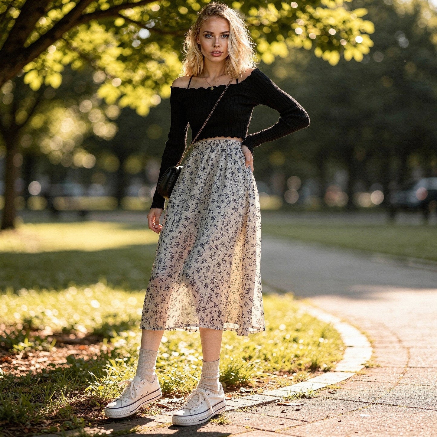 Light pink midi skirt with a flowy silhouette, featuring delicate floral patterns and a soft, lightweight fabric, view