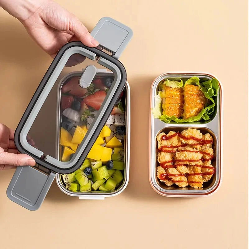 View of a sleek stainless steel double layer lunch box featuring a smooth silver finish and secure lid design