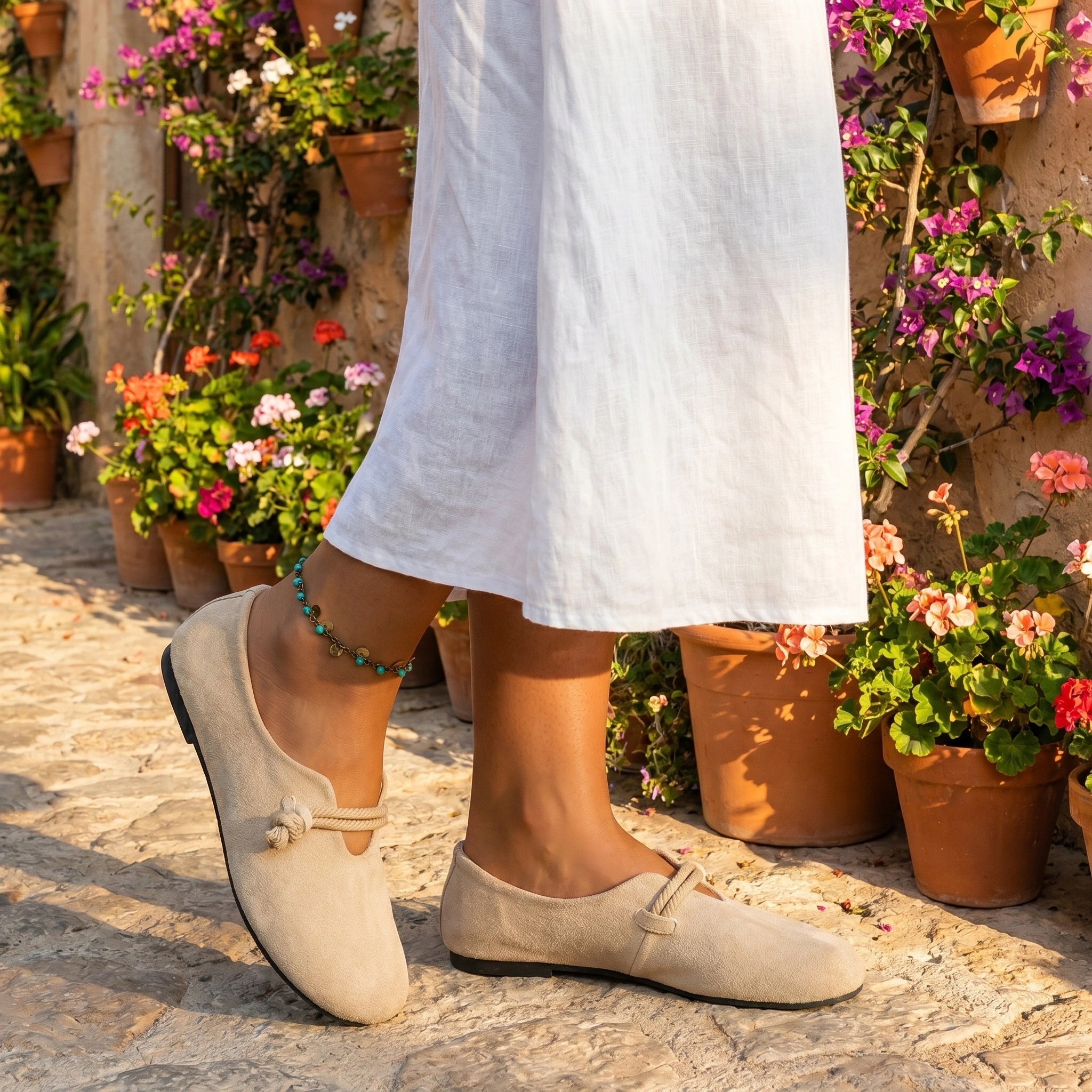 Back view of a model wearing Womens Effortless Summer Orthopedic Loafers in a soft beige color, showing the shoe's design and quality construction details against a neutral background.