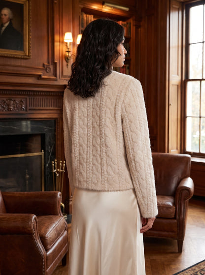 A model showcases the Womens Cropped Autumn Coat in a rich burgundy, styled with high waisted trousers against a soft neutral background.