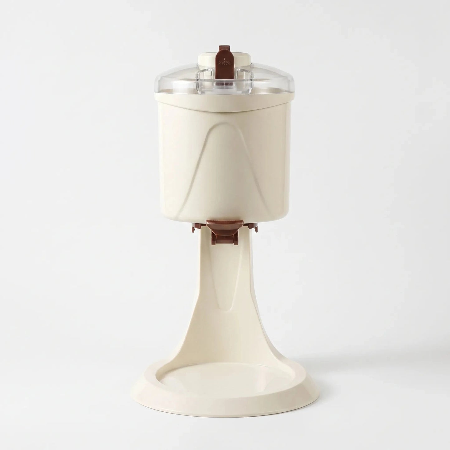 Angle view showcasing the sleek design, power cord placement, and ventilation vents of the compact ice cream maker