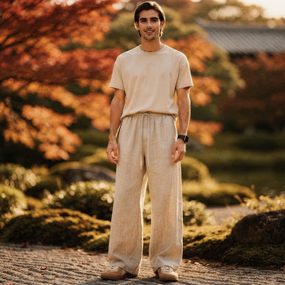 Lightweight summer trousers in light beige, featuring a relaxed fit and pockets, detailed view showcasing fabric texture