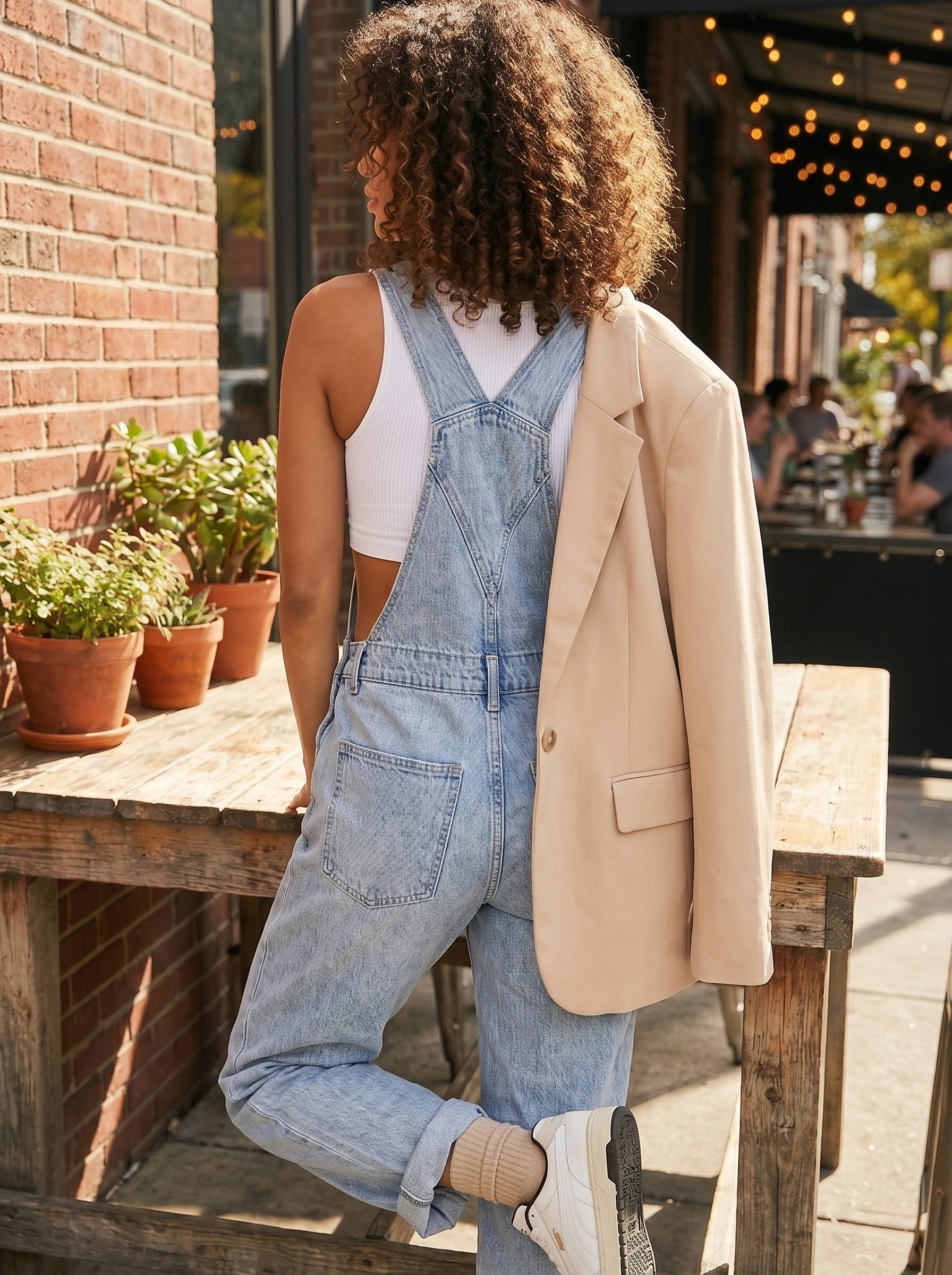 Close up view of the Women's Relaxed Effortless Jumpsuit showing its soft fabric, precise stitching, and high quality details against a neutral background.