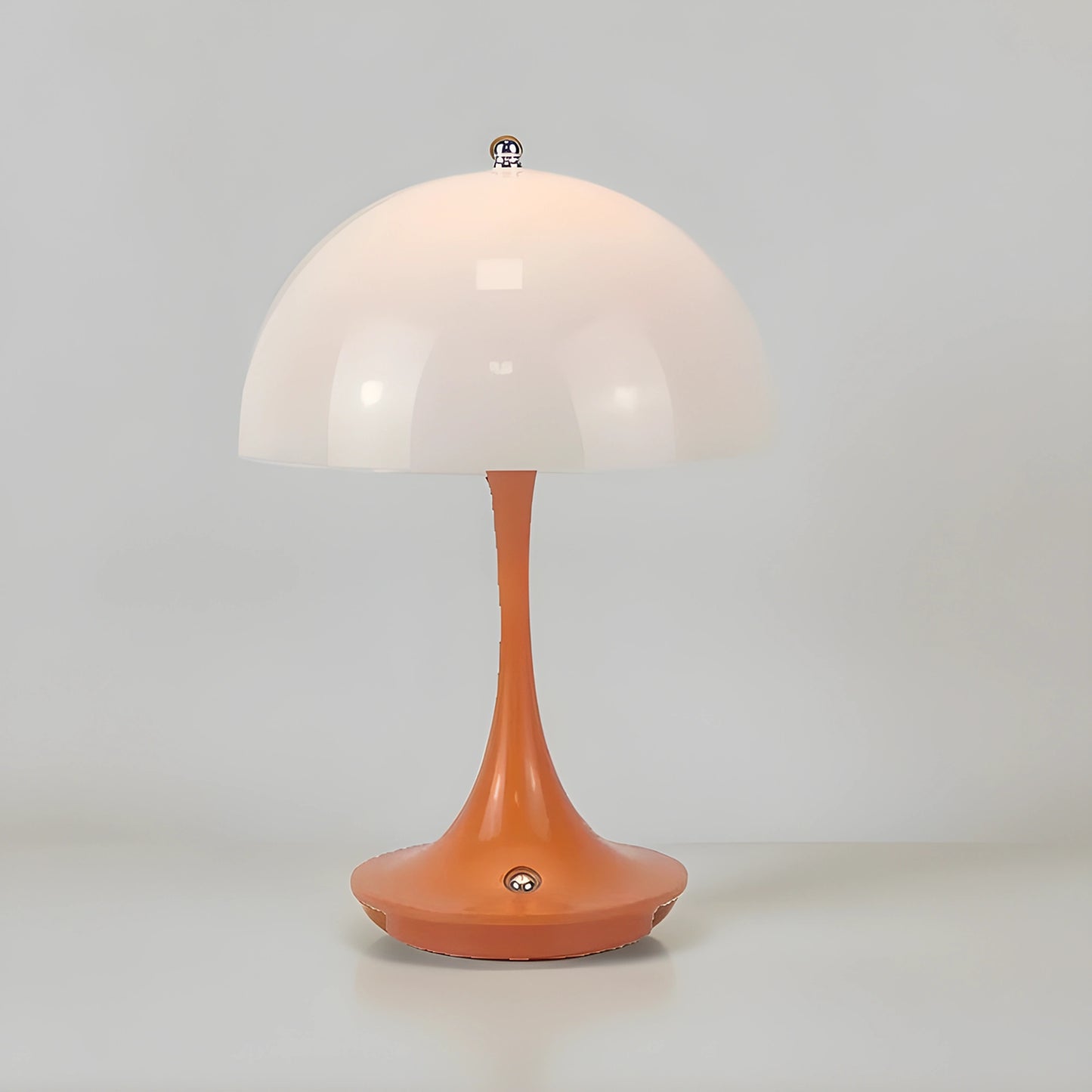 Sleek contemporary rechargeable table lamp in a warm metallic finish, showcasing a minimalist design and elegant shape, view