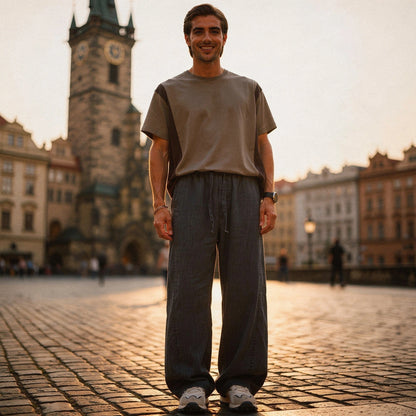 Lightweight summer trousers in a soft beige fabric, featuring a relaxed fit and pockets, view