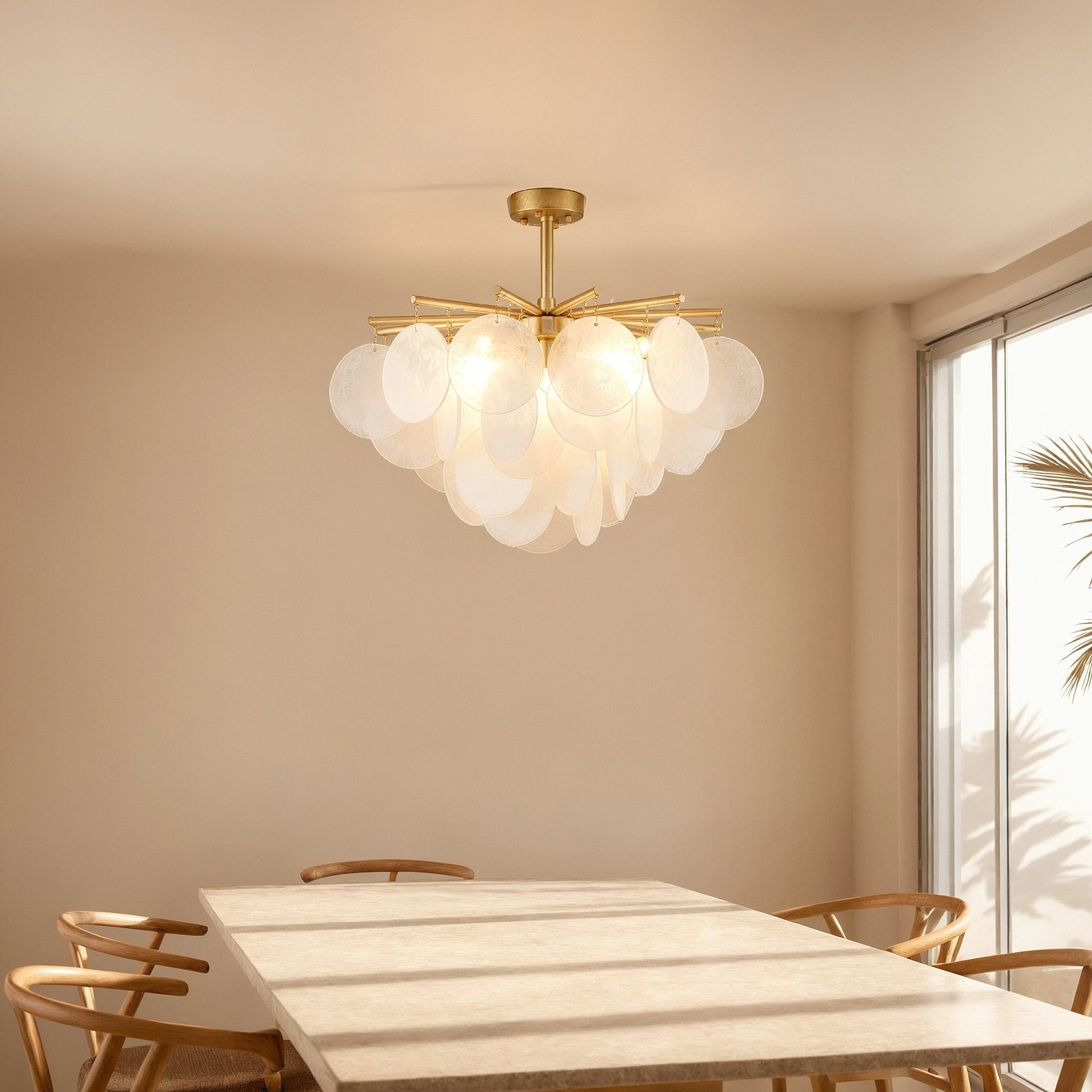 Close up view of the Layered Glass Chandelier showing its intricate glass layers and design against a softly lit dining room backdrop.