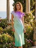 Front view of a model showing the Womens Effortless Midi Dress in a soft pastel color, styled with accessories against a bright, neutral background.