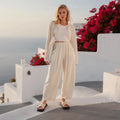 View of elegant high waisted wide leg pants in soft fabric, featuring a flattering silhouette and a classic design