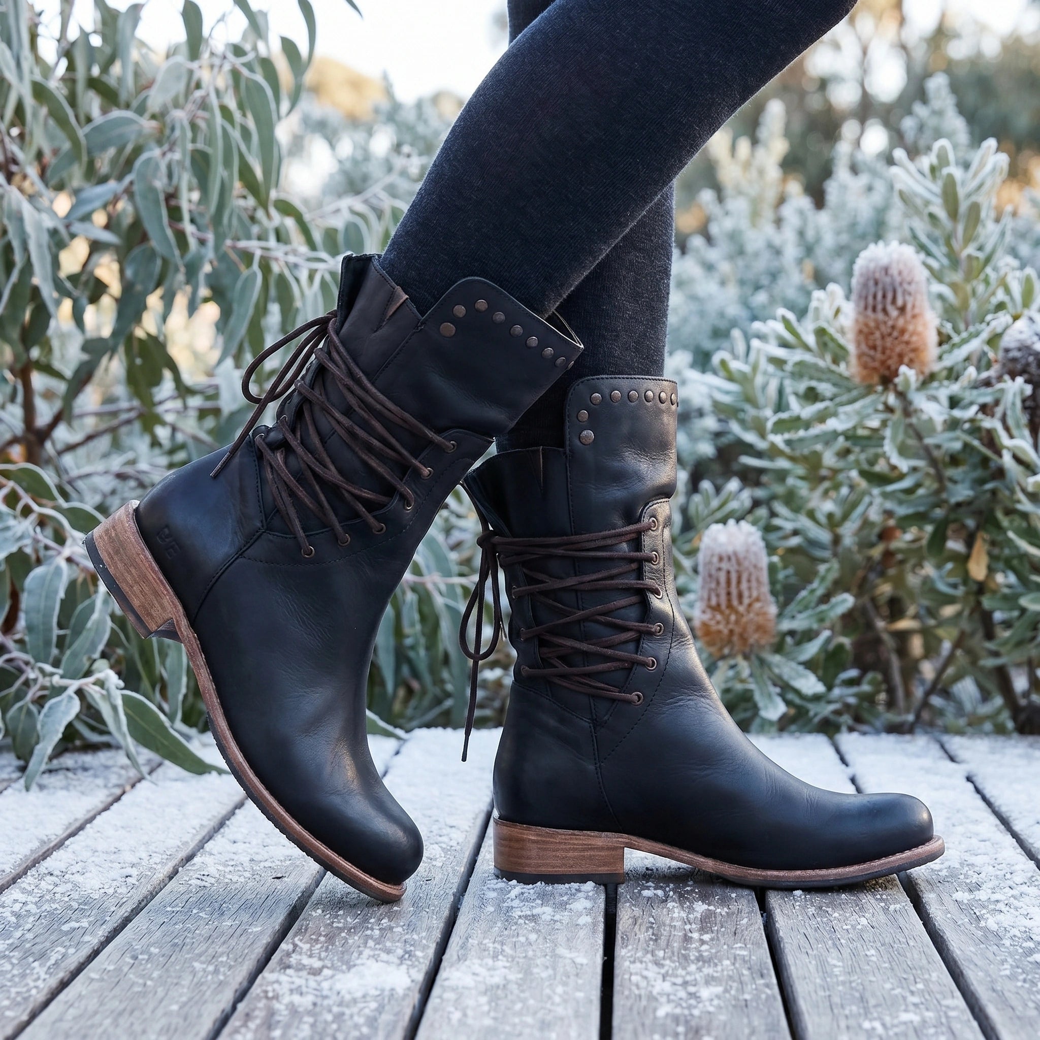 A model showcases the Womens Supportive Orthopedic Boots in a outfit, showing a neutral color palette against a softly lit urban background.