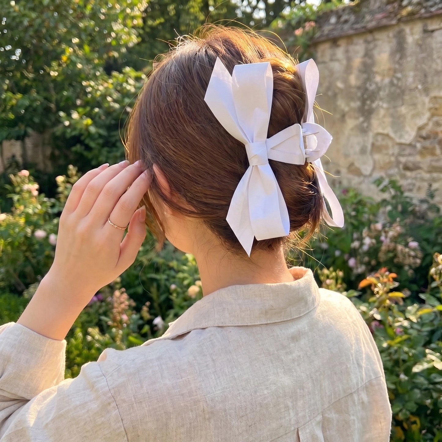 Close up view of the Womens Hair Clips showing intricate stitching and refined fabric details against a soft, neutral background.