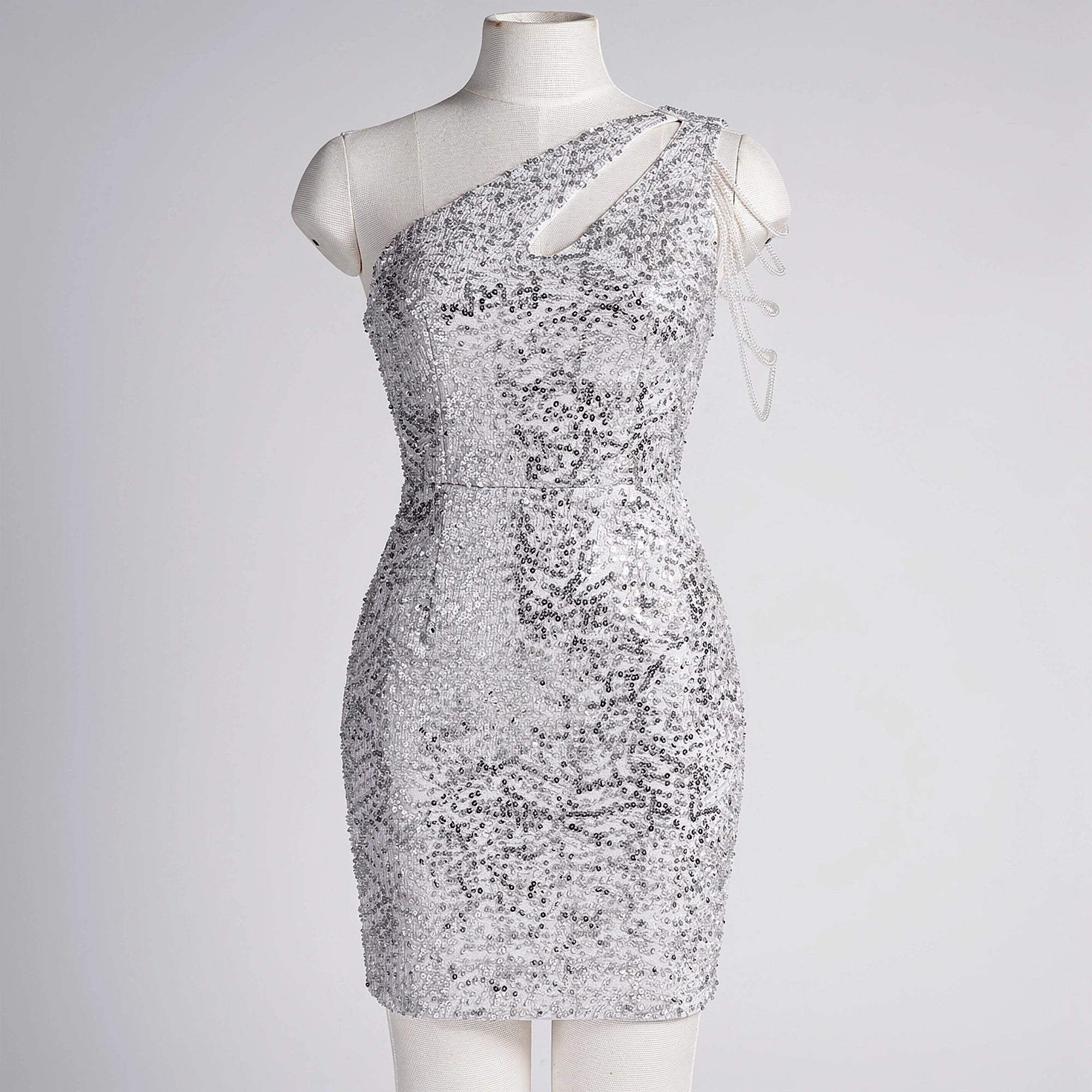 Elegant mini dress featuring shimmering sequins in a flattering silhouette, shown in view with a fitted waist