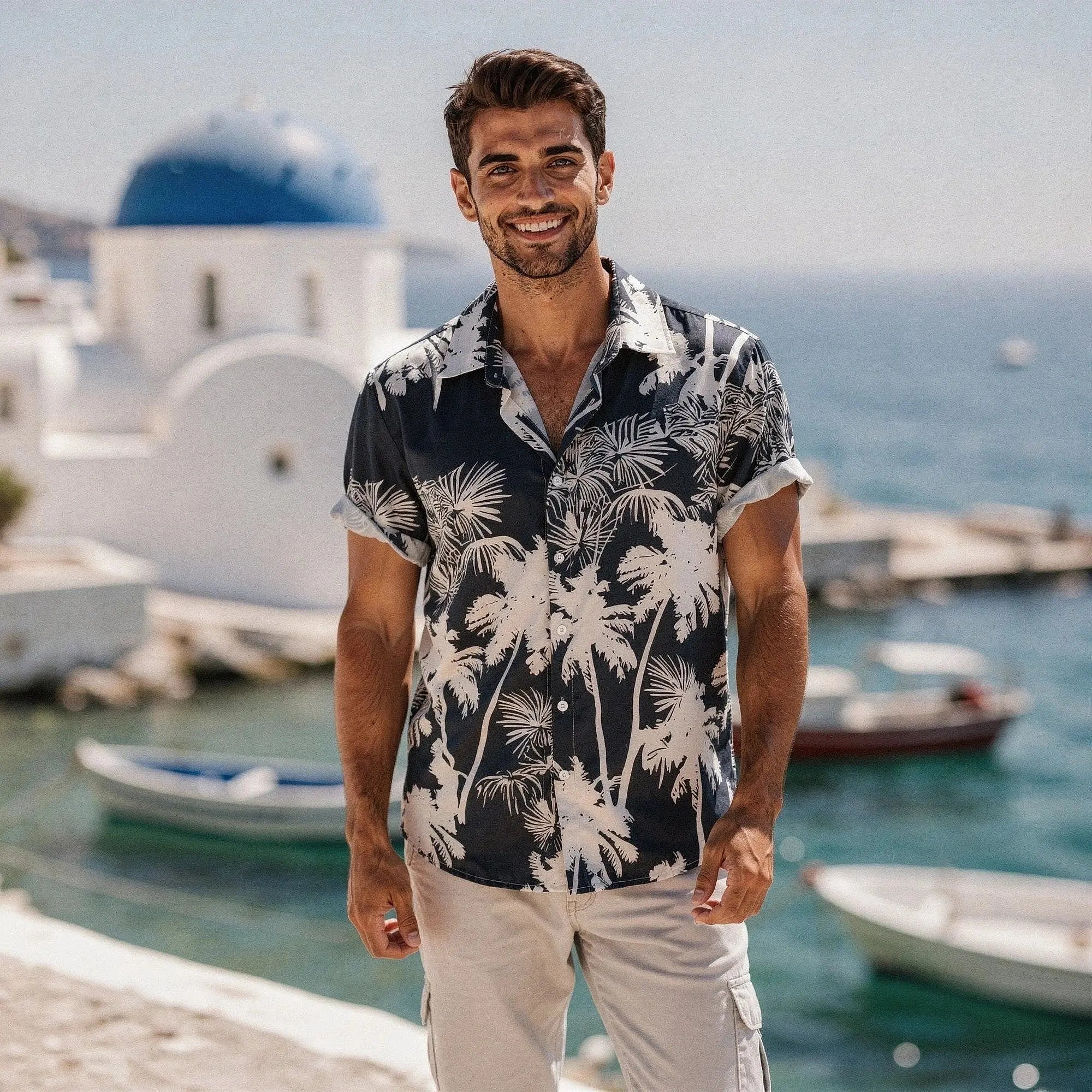 View of a slim fit short sleeve Hawaiian shirt featuring a vibrant floral pattern in shades of blue and green