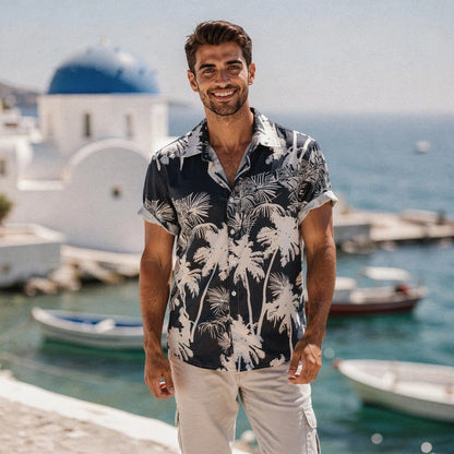 View of a slim fit short sleeve Hawaiian shirt featuring a vibrant floral pattern in shades of blue and green