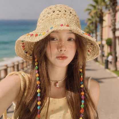 Colorful crochet summer bucket hat featuring a wide brim and intricate patterns, detailed view showcasing vibrant hues