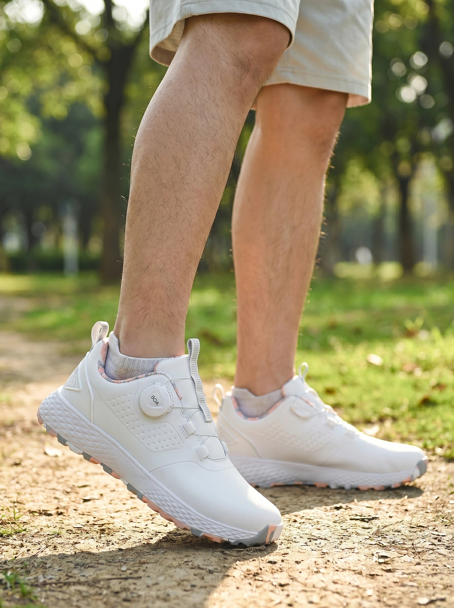 Close up view of the waterproof fabric and precise stitching of men's casual golf sneakers, showing their durable design and attention to .
