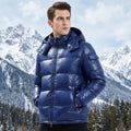 Front view of a model showing a mens warm winter puffer jacket in navy blue, paired with casual outdoor wear against a neutral background.