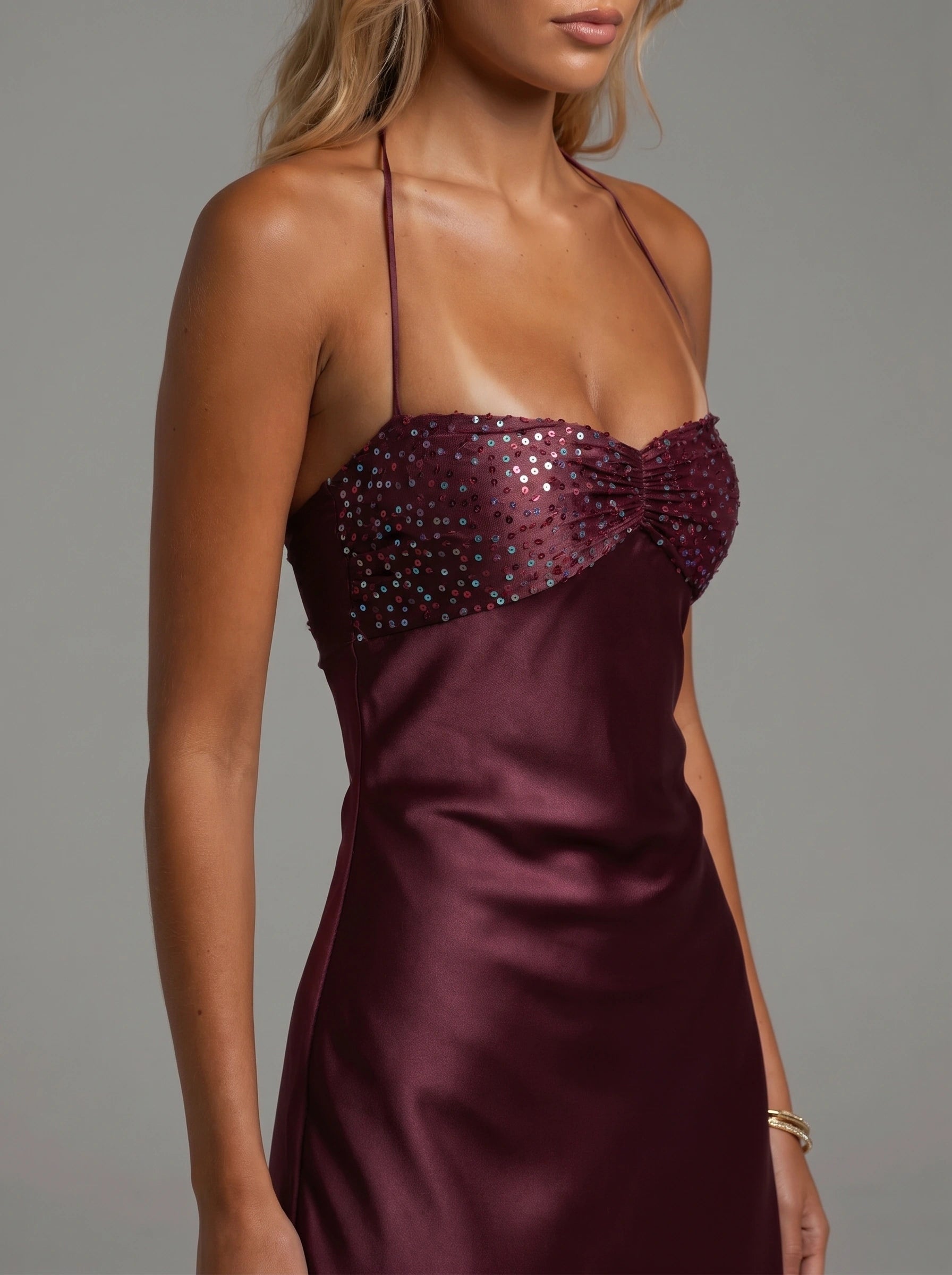 Close up view of the Women's Sexy Summer Bodycon Dress showing intricate stitching and luxurious fabric texture against a soft neutral background.