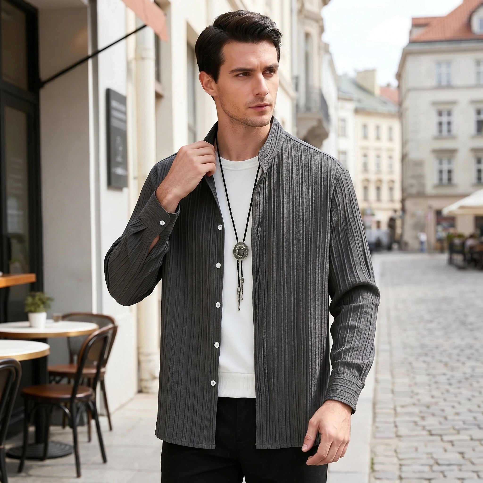 Close up view of the mens textured relaxed spring shirt showing the intricate fabric details and stitching, showing its casual yet sophisticated style.