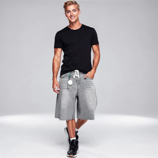 Relaxed denim knee length shorts in light blue, featuring a classic five pocket design and a view