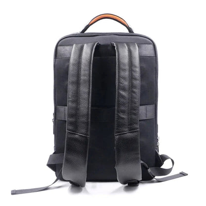 View of a sleek genuine leather backpack in dark brown, featuring a fingerprint lock and minimalist design elements