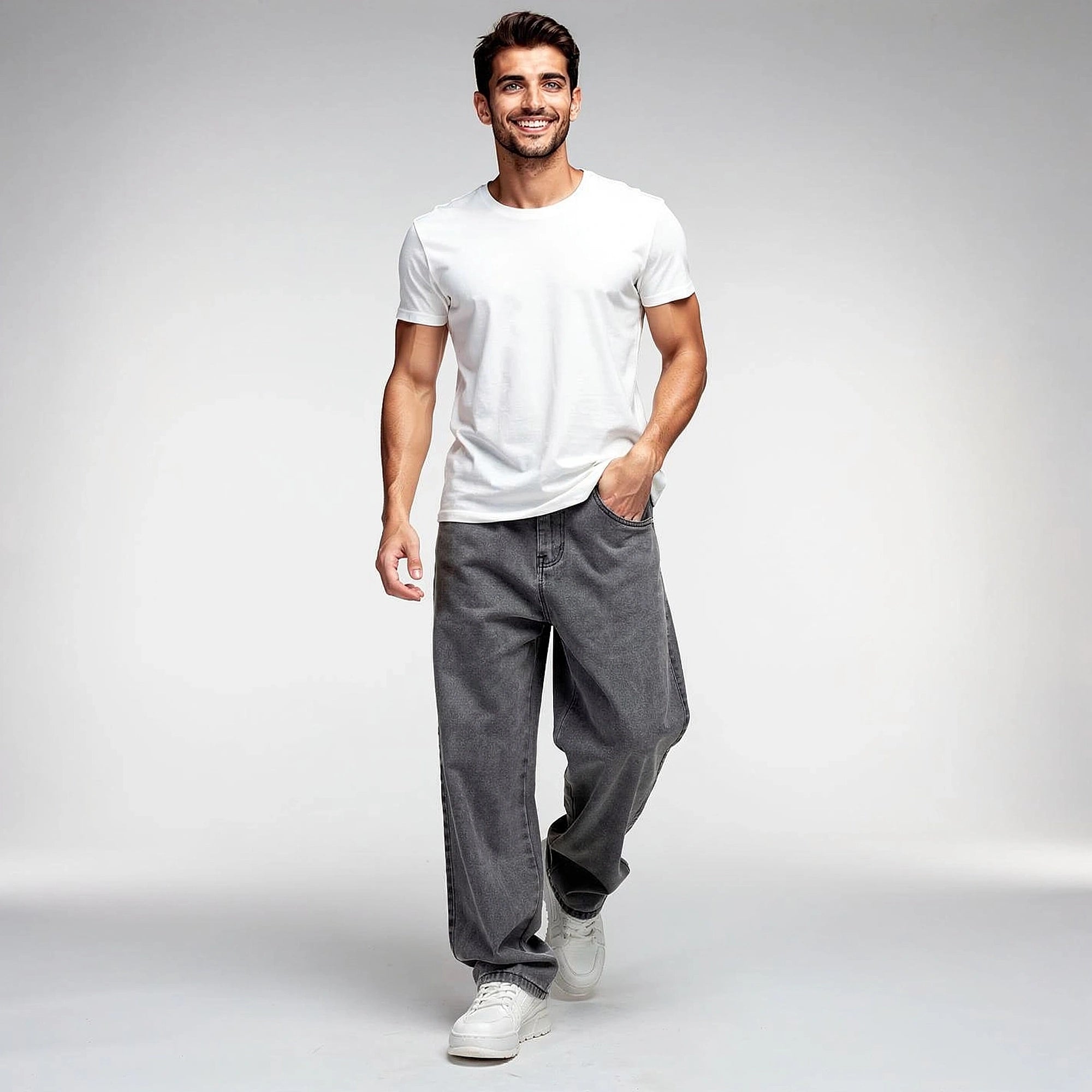 View of loose fit straight leg casual jeans in medium blue denim with subtle fading and classic five pocket design