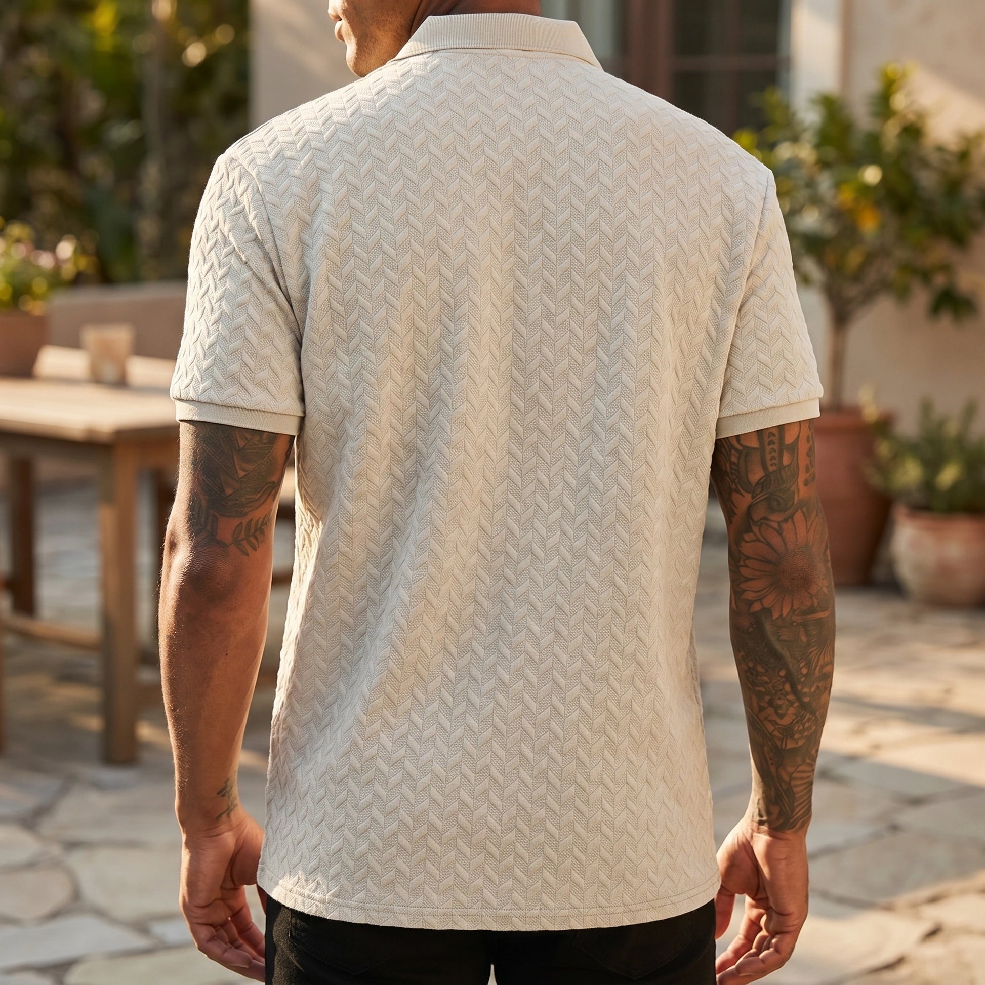 Close up view of the breathable fabric and precise stitching of the men's solid summer polo shirt, showing its quality and design.