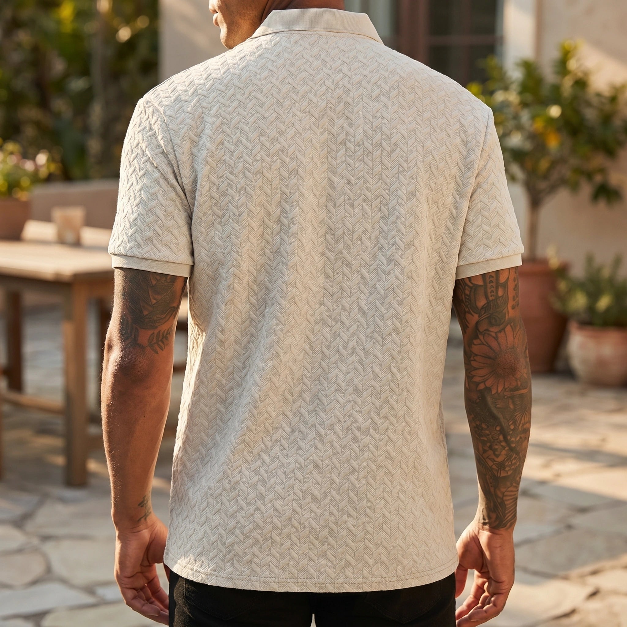Close up view of the breathable fabric and precise stitching of the men's solid summer polo shirt, showing its quality and design.