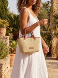 Close up view of the Womens Woven Summer Tote showing intricate stitching and textured fabric, perfect for beach and casual outings.