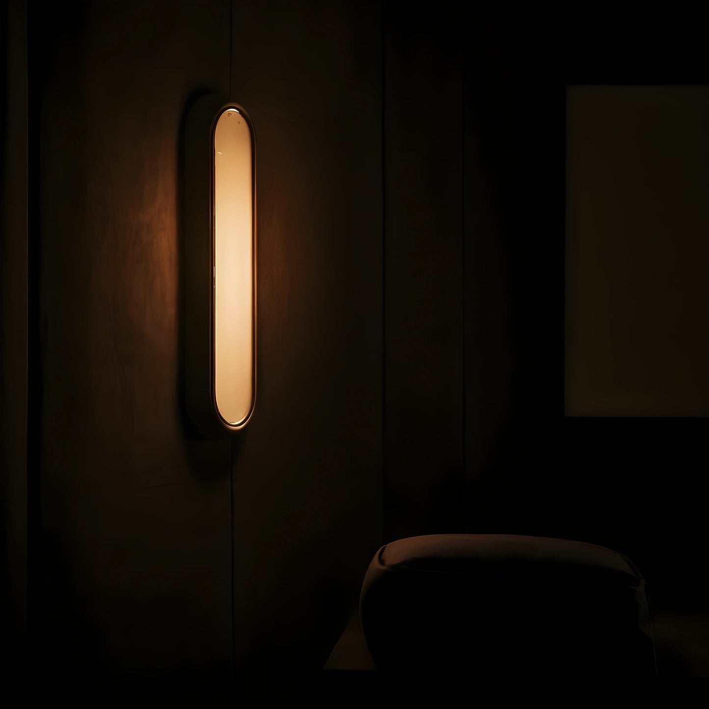 View of an elegant alabaster wall sconce featuring a sculptural design and soft ambient light in a warm cream color