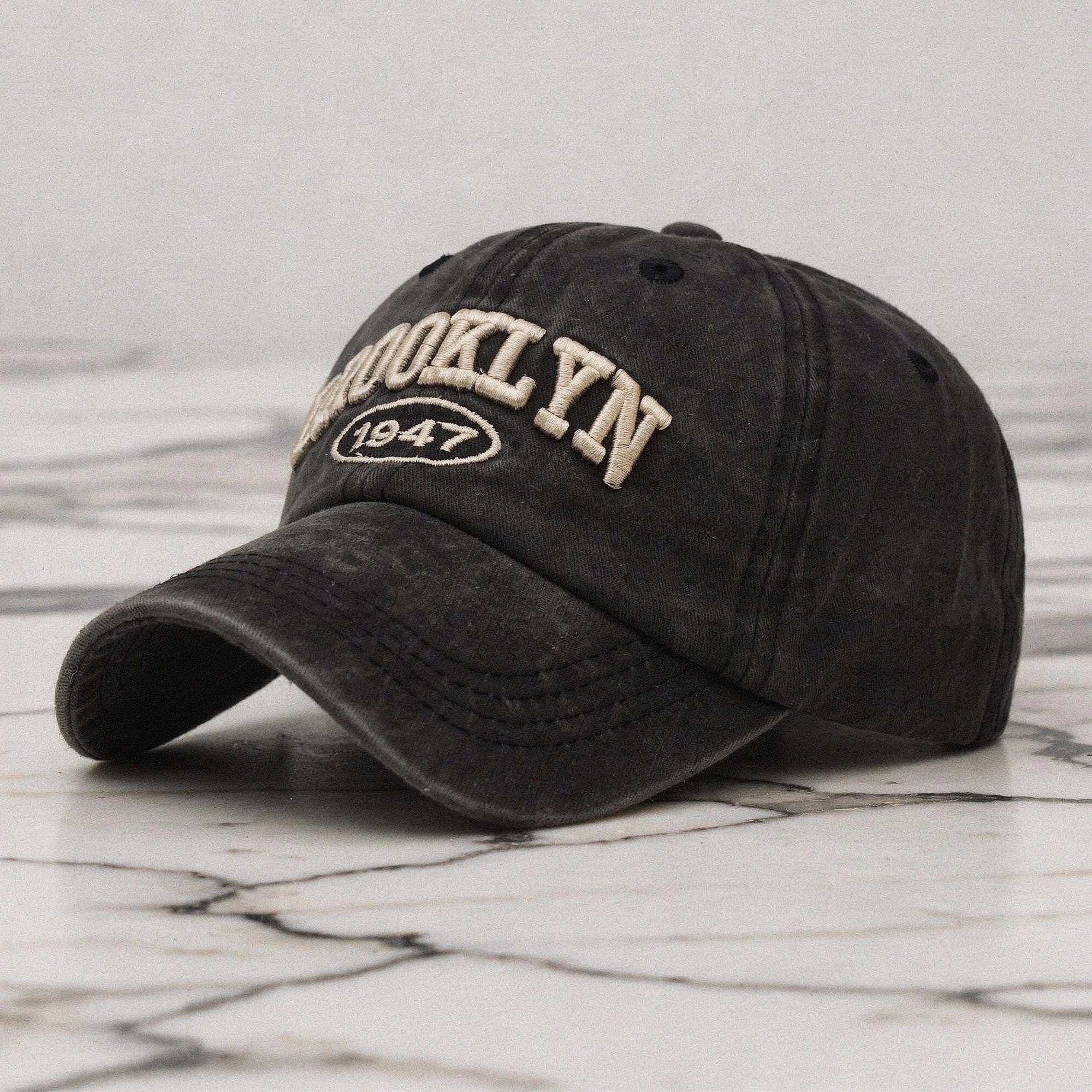 View of a navy blue embroidered cap featuring a casual chic design, made
