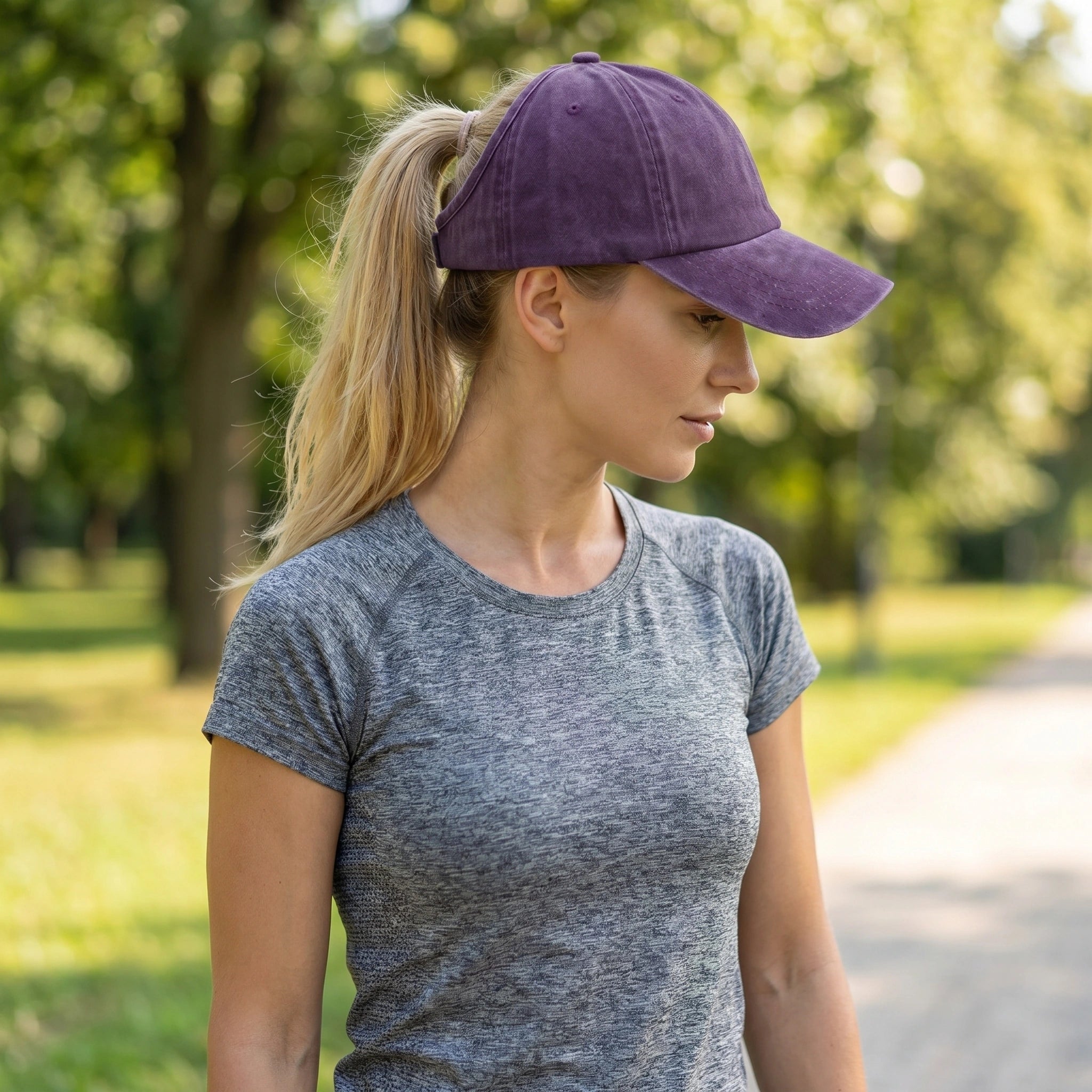 Close up view of the washed cotton fabric and precise stitching details of the versatile backless baseball cap in a soft neutral hue.