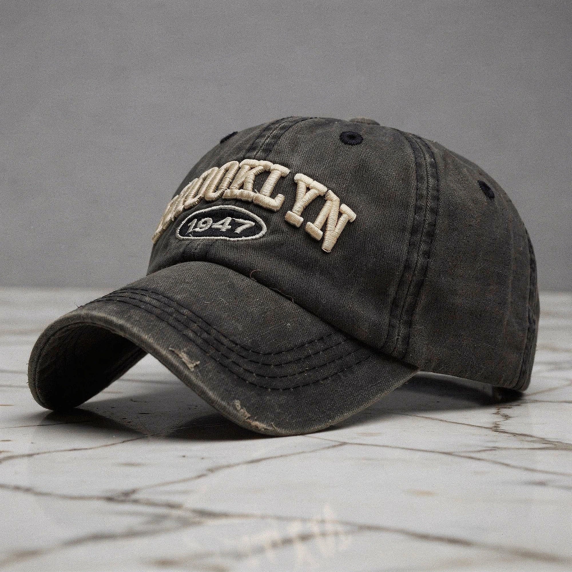 View of a khaki green embroidered cap featuring a casual chic design and adjustable strap at the