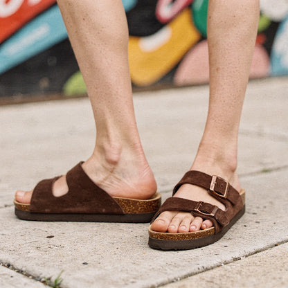View of relaxed summer sandals in light tan leather, featuring a comfortable footbed and adjustable straps