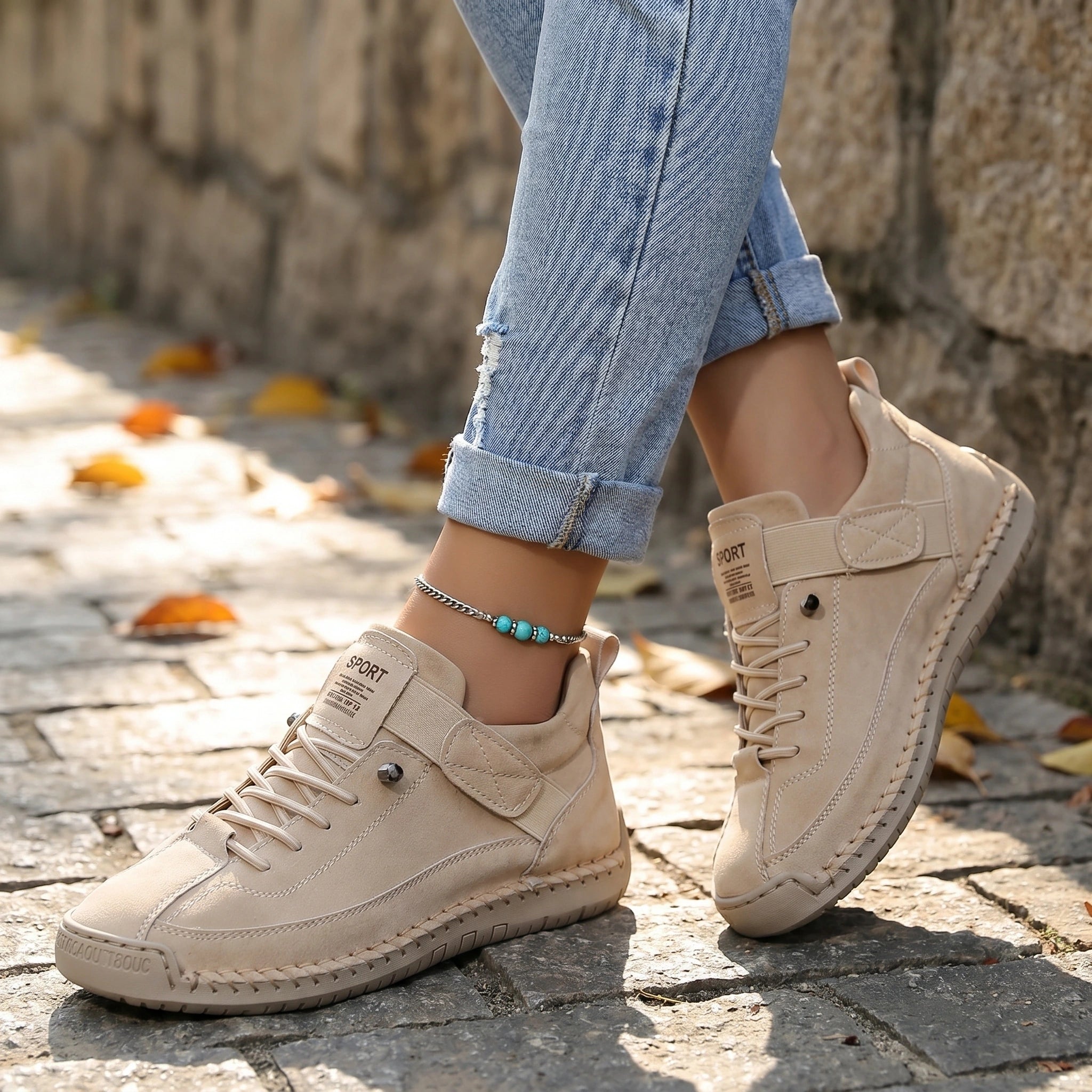 Close up view showing the intricate stitching and breathable fabric of orthopedic sneakers in a soft pastel hue, showing their quality and design.