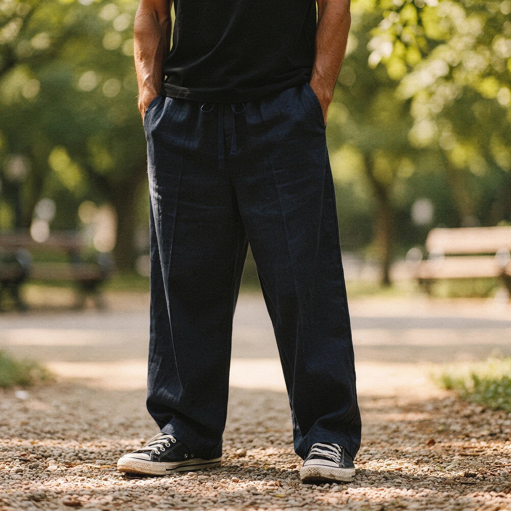 Lightweight casual trousers in a soft beige fabric, featuring a relaxed fit and pockets, view