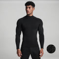 View of a black fleece backed compression winter tee with long sleeves and a fitted design