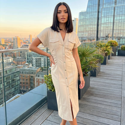 A model showcases the Womens Slim Midi Dress in a soft pastel color, styled with minimal accessories against a neutral backdrop.