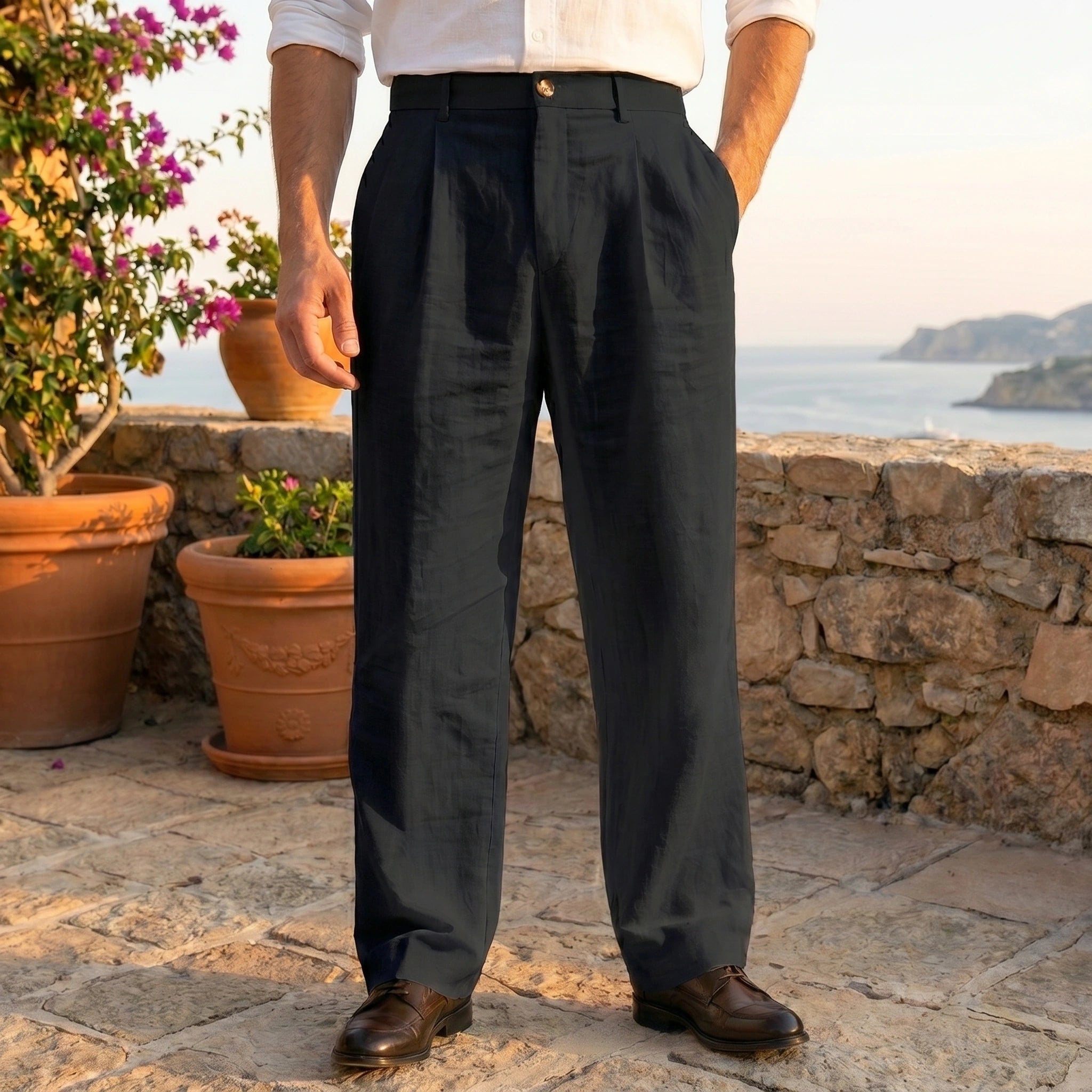 Close up view showing the lightweight linen fabric and precise stitching details of the men's relaxed summer pants in a soft beige color.
