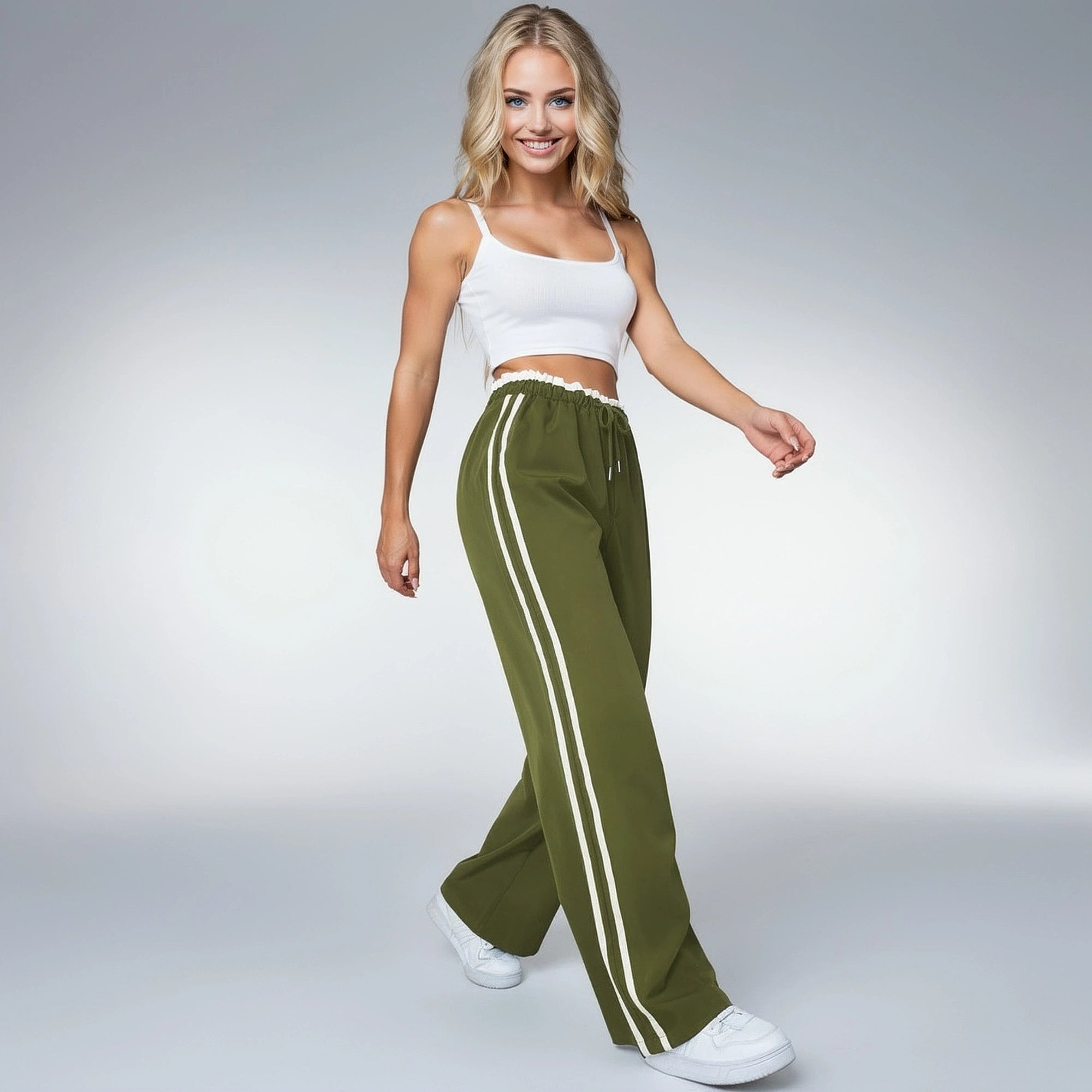 View of relaxed wide leg pants in soft fabric, featuring a light gray color and an elastic waistband