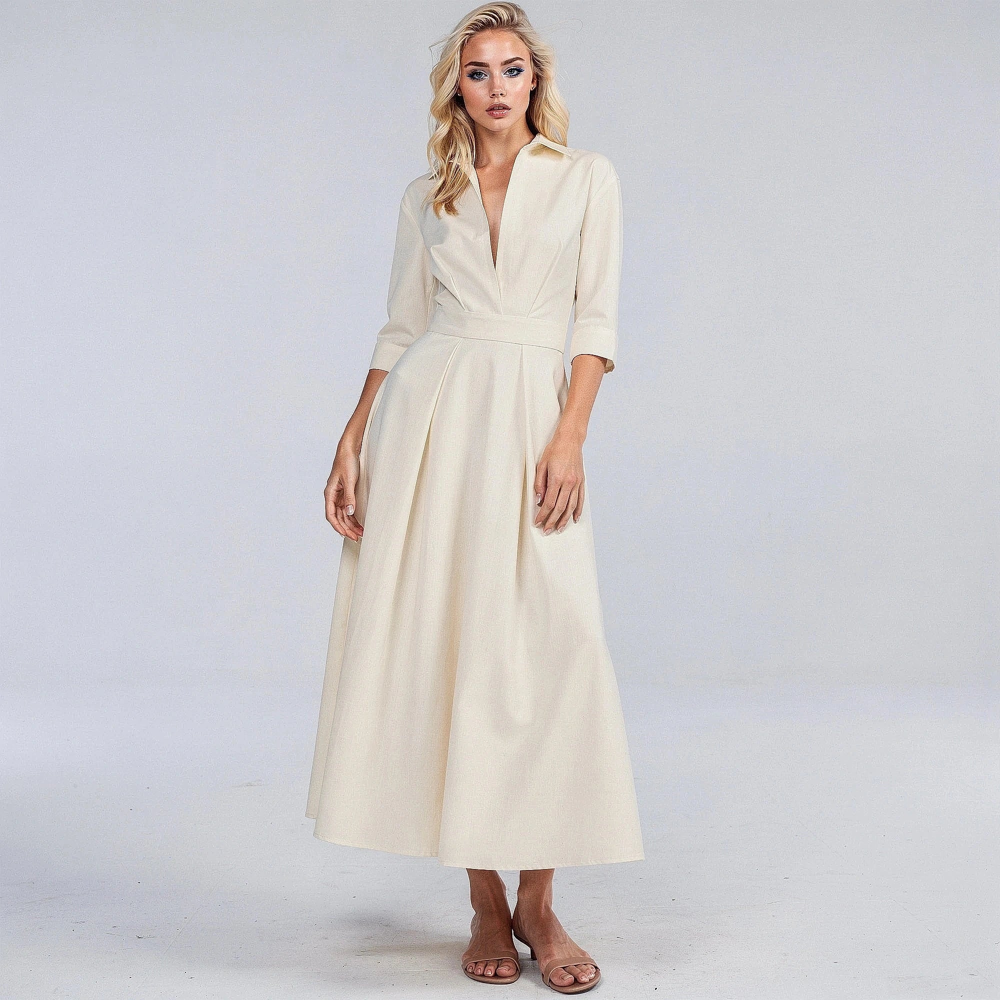 View of a flowing midi dress in soft fabric, featuring a button and a relaxed fit in a light pastel color