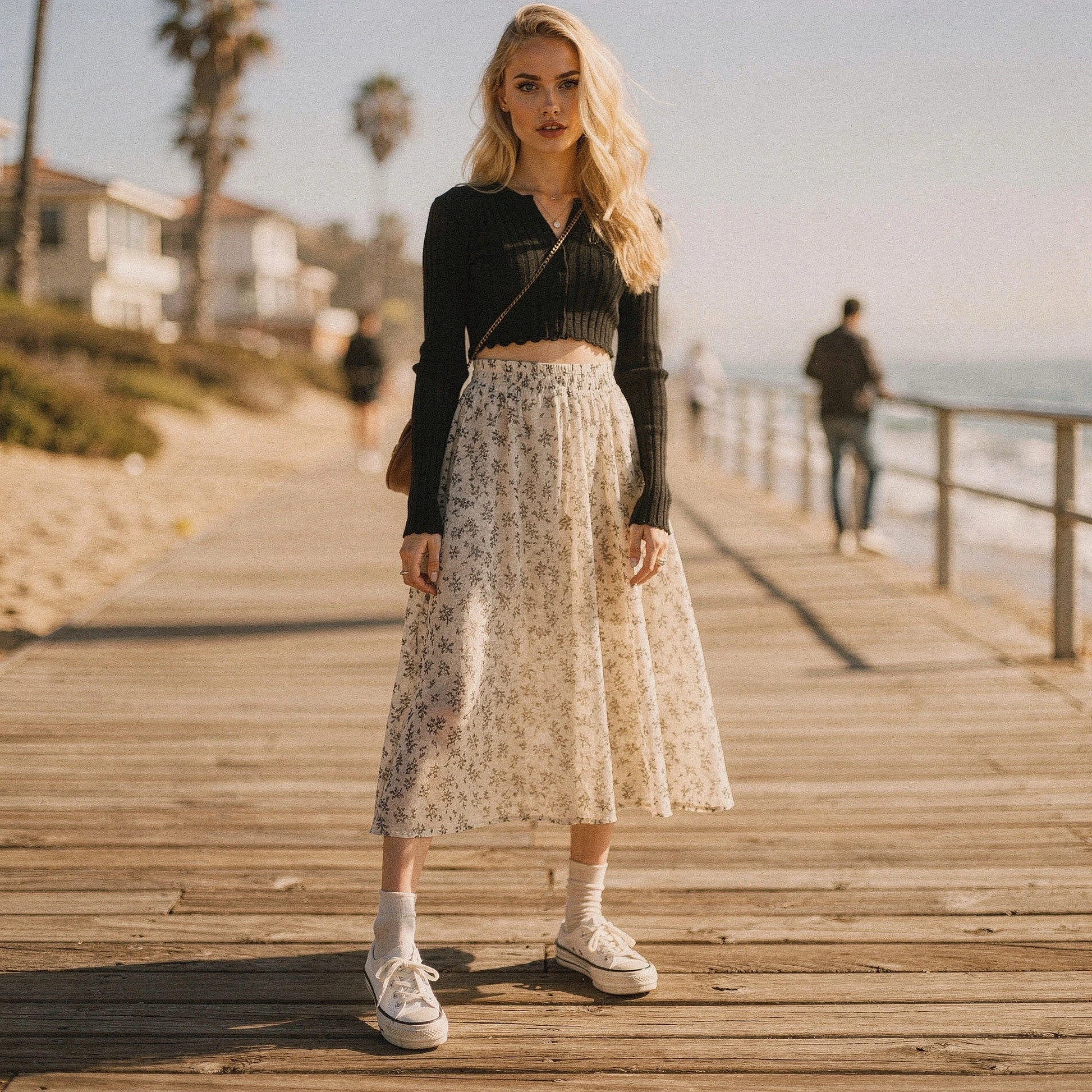 Light pink midi skirt with a flowy silhouette, featuring delicate floral patterns and a soft, lightweight fabric, view