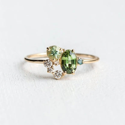 View of an elegant women's ring featuring a delicate design with a vibrant peridot gemstone set in silver