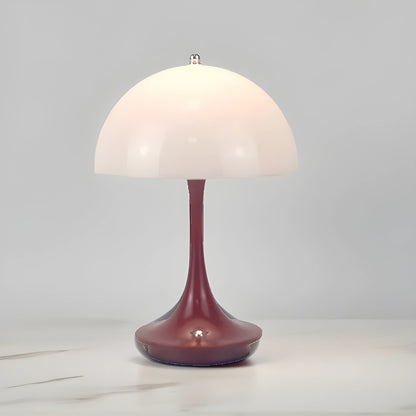 View of a sleek contemporary rechargeable table lamp in a warm metallic finish, showcasing its elegant design and modern features