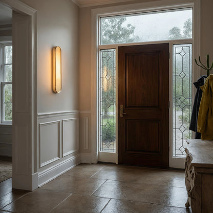 Elegant alabaster wall sconce featuring a sculptural design, soft ambient light, and a detailed view