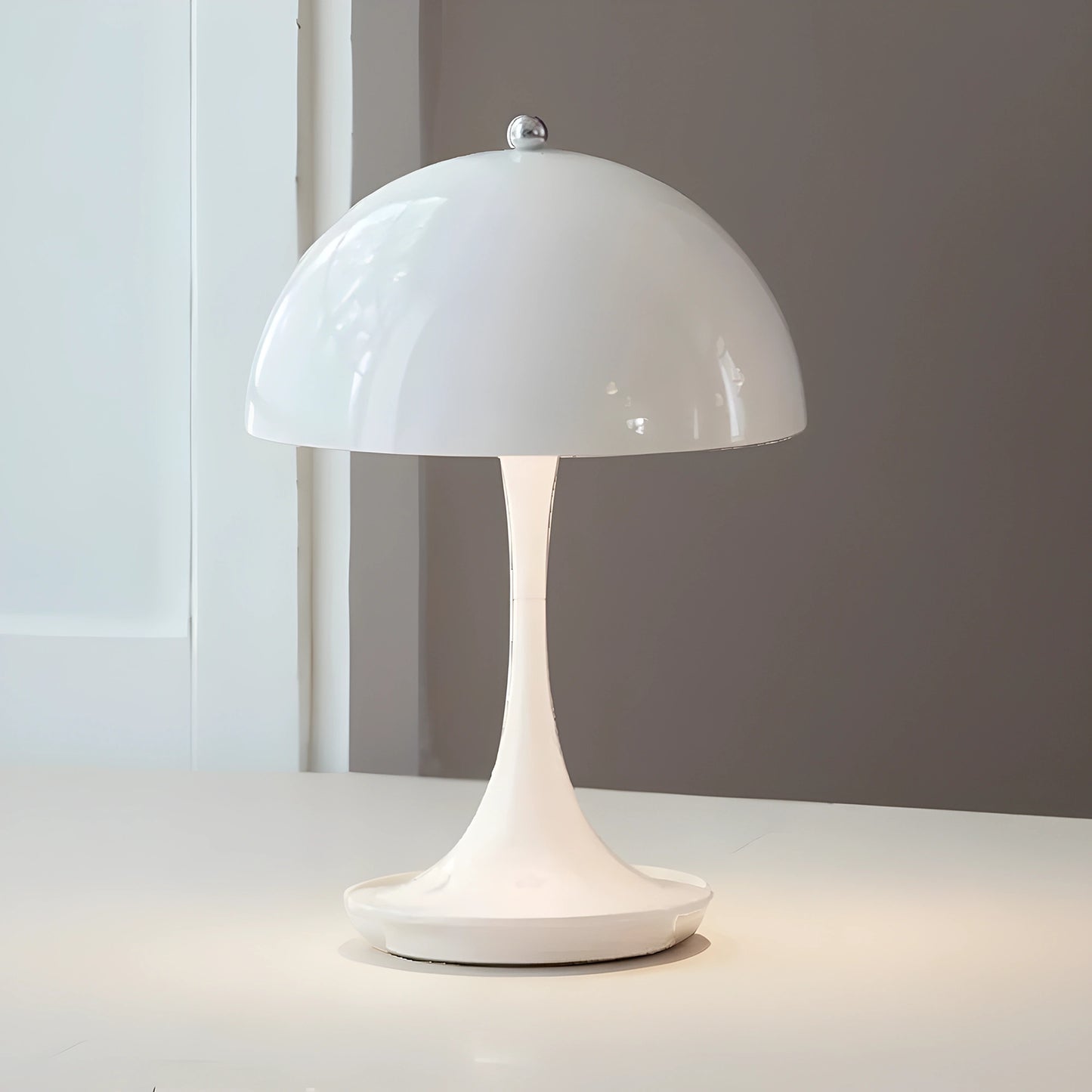 Sleek contemporary rechargeable table lamp in a warm gray finish, view showcasing its elegant shape and modern design