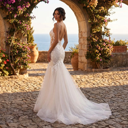 Close up of the Womens Backless Wedding Dress showing intricate stitching and luxurious fabric texture against a soft, neutral background.