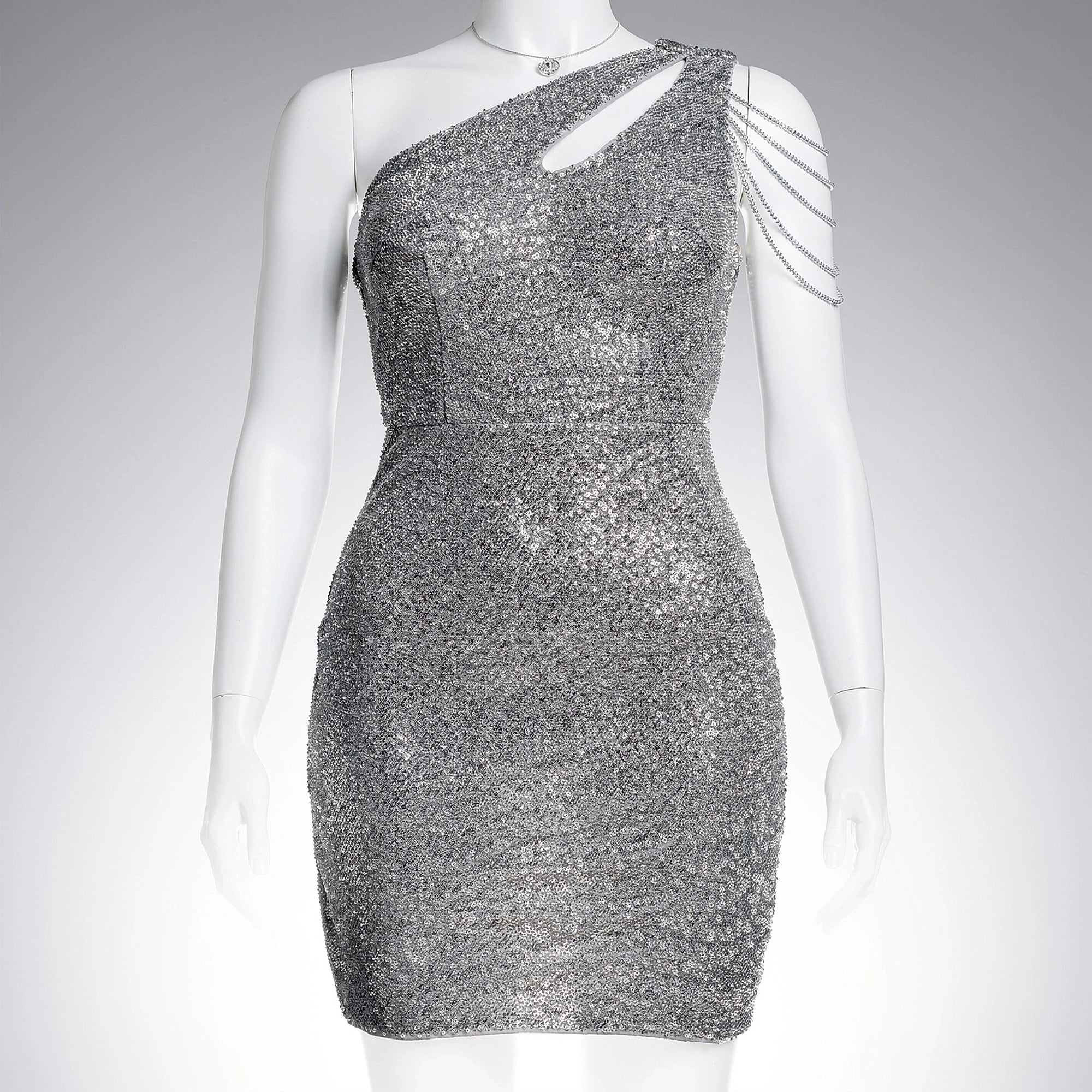View of a shimmering silver sequin mini dress featuring a fitted silhouette and delicate spaghetti straps