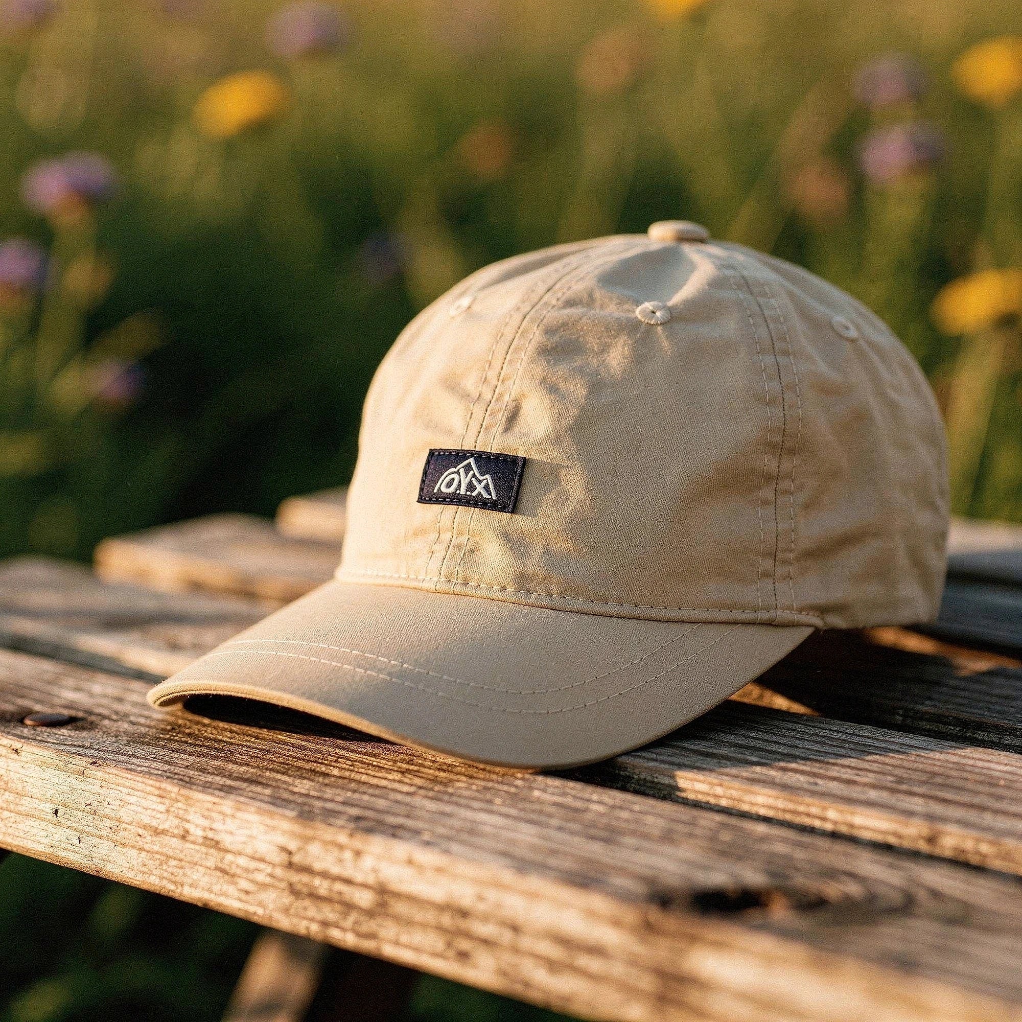 View of a stylish black baseball cap made from breathable fabric, featuring a curved brim and adjustable strap