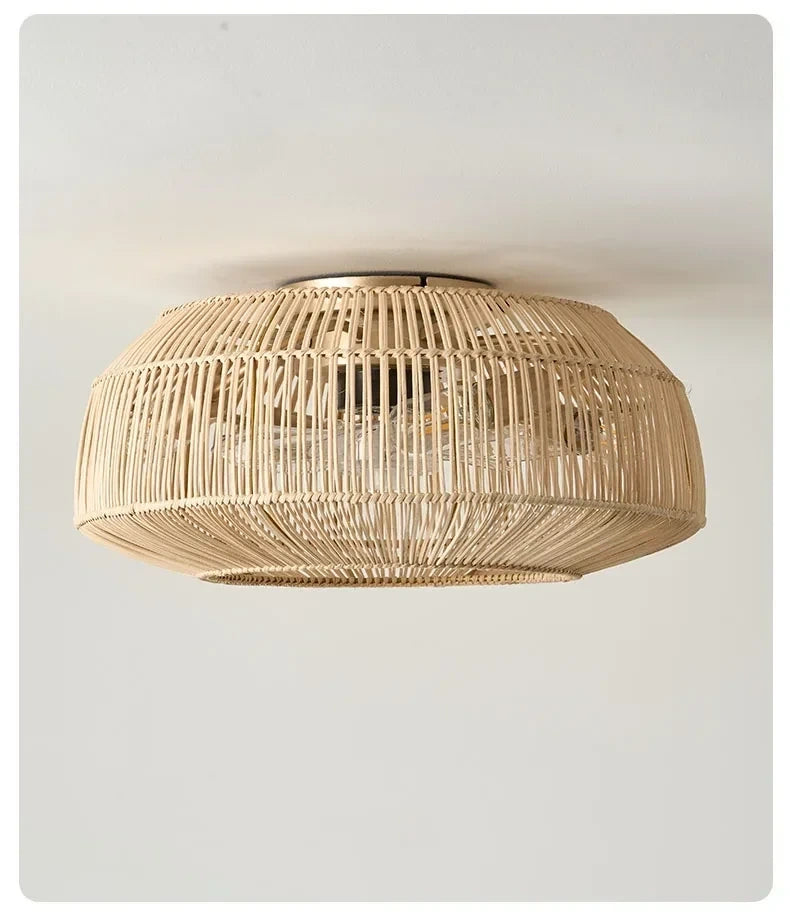 Of the rattan ceiling fan's intricate weaving, highlighting the textured finish and elegant light fixture design
